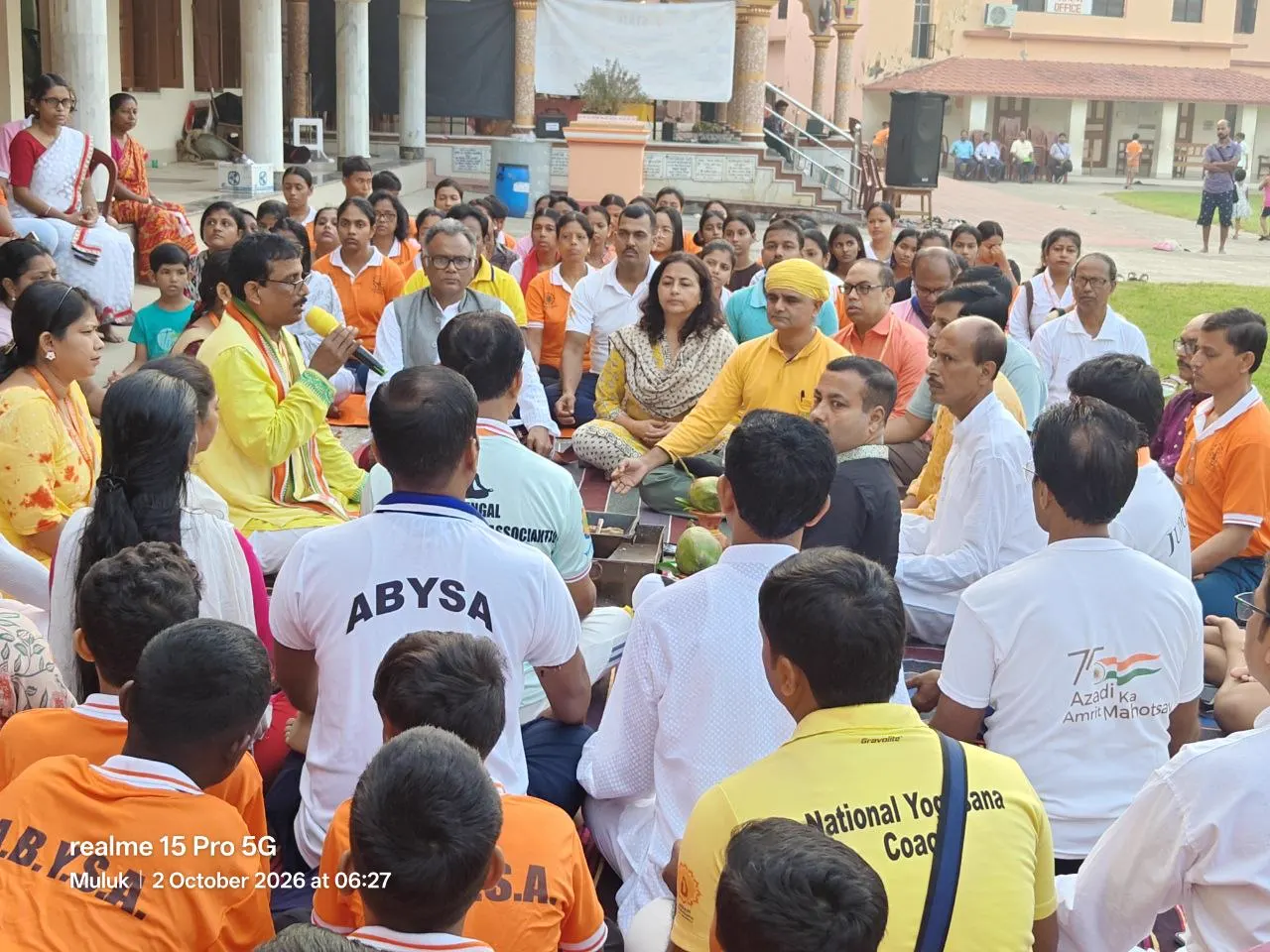 A circle seated on the ashram field at Muluk.
